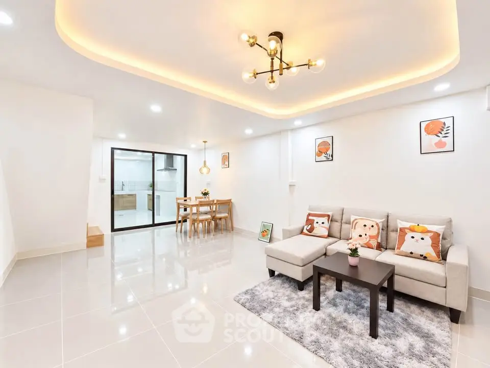 Spacious modern living room with stylish lighting and cozy decor