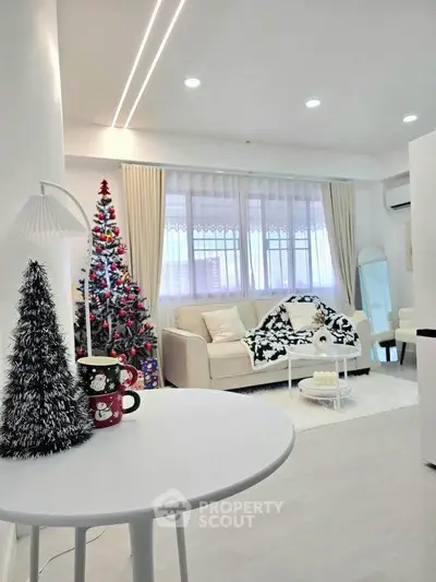 Cozy living room with festive decor and modern furnishings