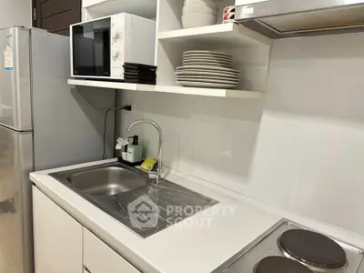 Modern kitchen with sleek appliances and ample storage space