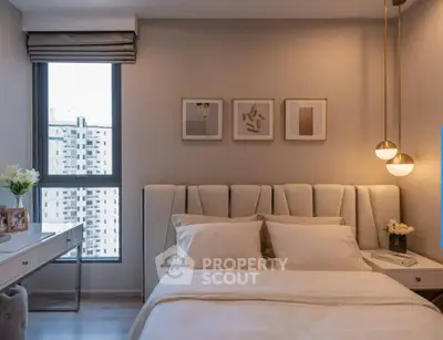 Luxurious bedroom with elegant decor and city view, featuring plush bedding and modern lighting.
