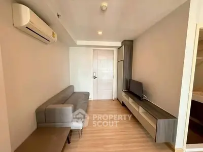 Modern living room with sleek furniture and air conditioning in a stylish apartment.