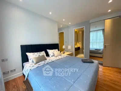 Spacious modern bedroom with ensuite bathroom and stylish decor