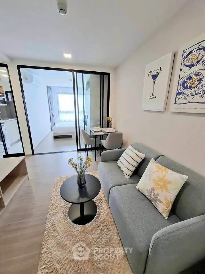 Modern living room with cozy sofa and stylish decor in a contemporary apartment.