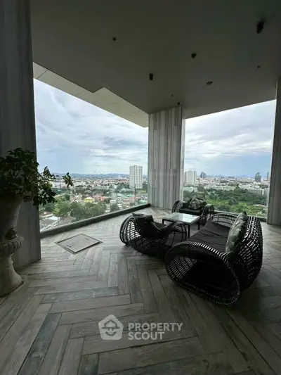 Luxurious balcony with stunning city view and modern outdoor seating