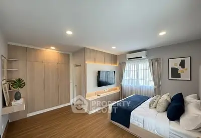 Modern bedroom with stylish decor and natural light