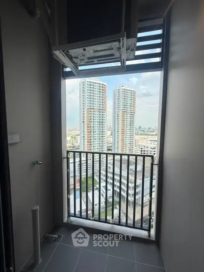 High-rise apartment balcony with stunning cityscape view and modern design.