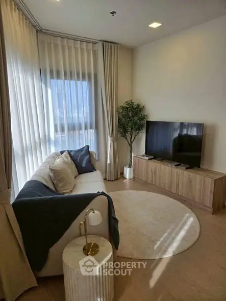 Cozy modern living room with natural light and stylish decor