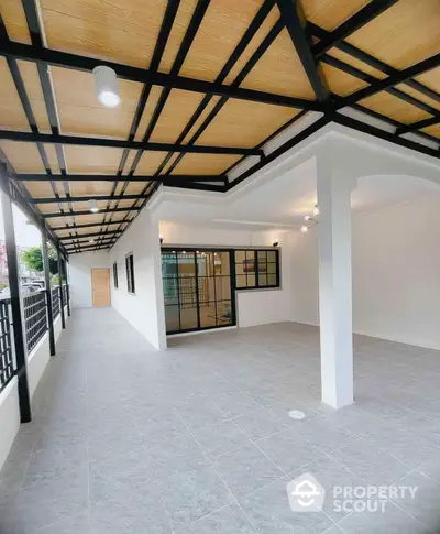 Spacious balcony with modern design and stylish ceiling in a contemporary home