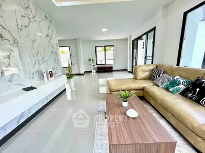 Spacious modern living room with marble accent wall and elegant beige sofa