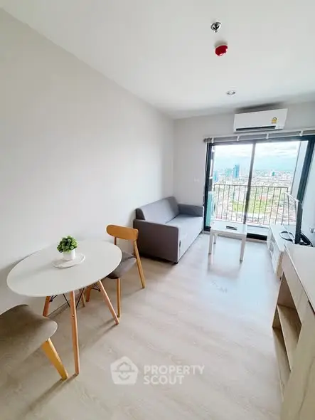 Modern living room with balcony view in high-rise apartment