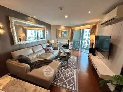 Luxurious living room with modern decor and large windows offering a stunning view.