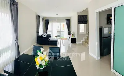 Spacious modern living room with elegant dining area and natural light