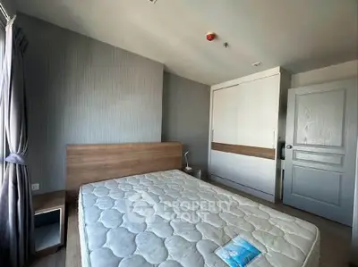 Spacious bedroom with modern design and ample natural light