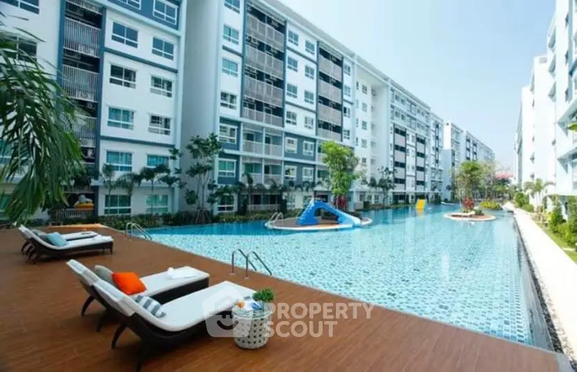 Luxurious apartment complex with stunning pool and modern amenities for ultimate relaxation.