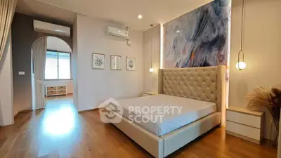 Luxurious bedroom with modern decor and elegant lighting