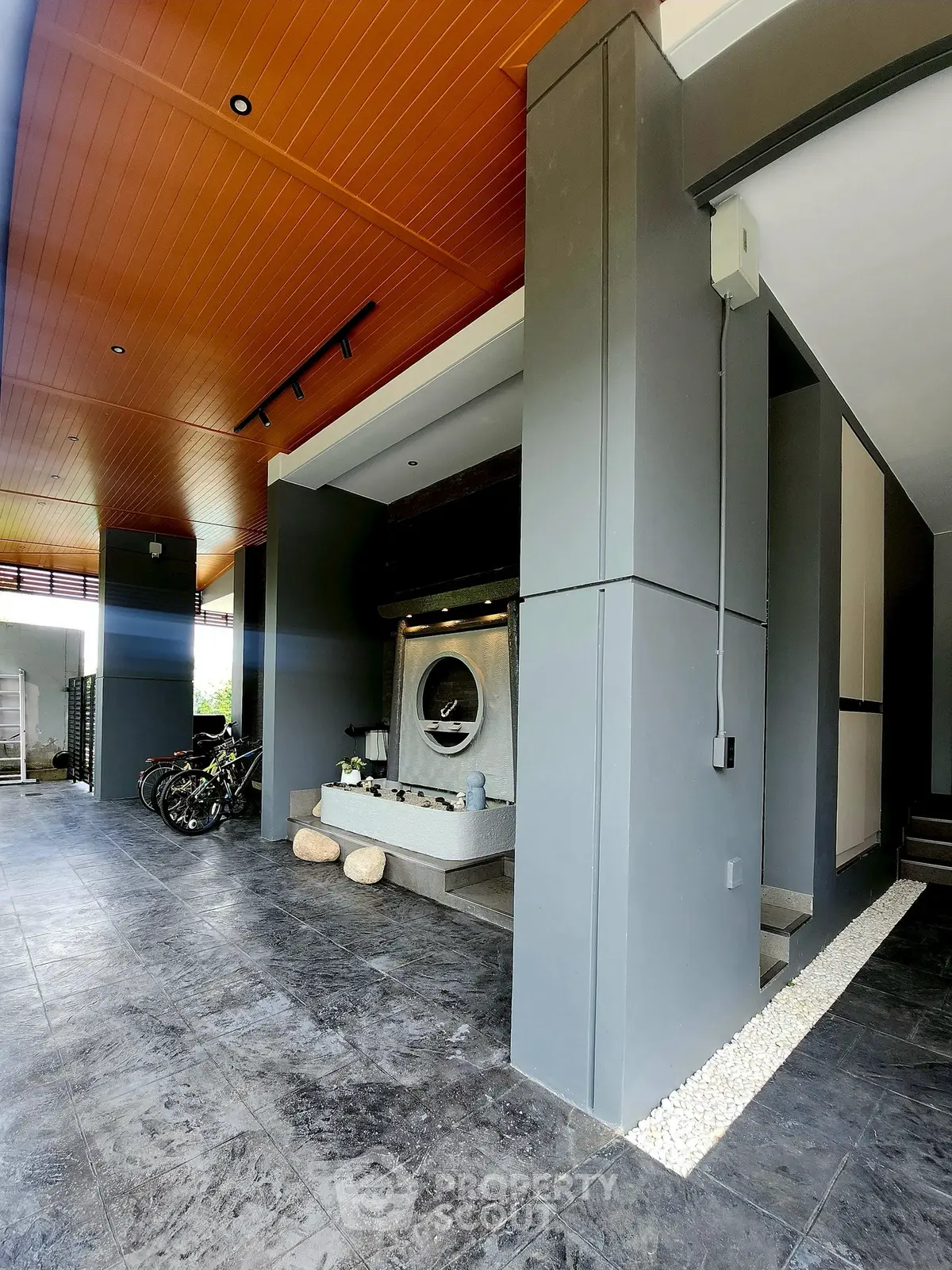 Modern home entrance with sleek design and bicycle storage area
