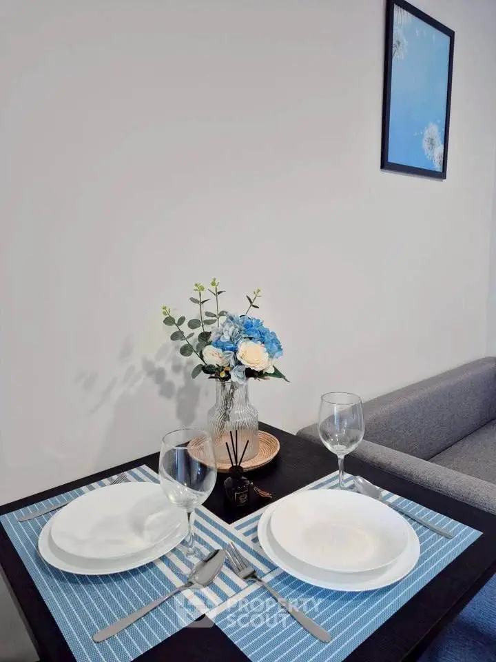 Elegant dining setup with blue accents in modern living space