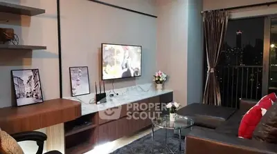 Modern living room with city view, stylish decor, and cozy seating area.