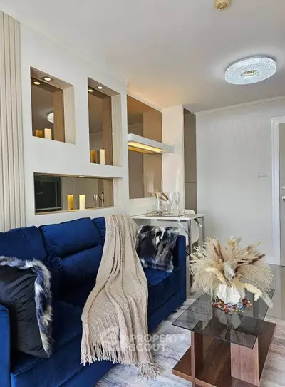 Stylish modern living room with blue sofa and elegant decor