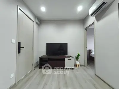 Modern living room with sleek TV setup and minimalist decor