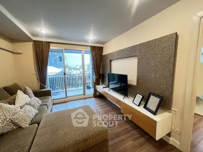 Spacious living room with modern decor and balcony view in urban apartment