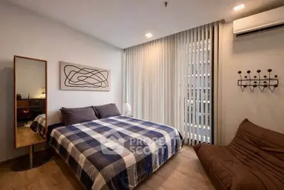 Modern bedroom with stylish decor and natural light