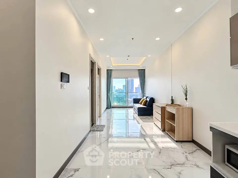 Spacious modern living room with marble flooring and city view, featuring elegant decor and ample natural light.