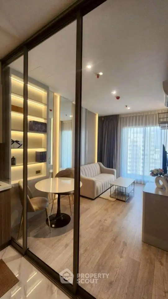 Modern living room with floor-to-ceiling windows and elegant decor