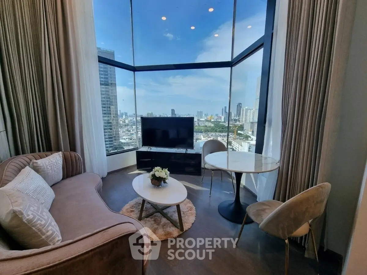 Luxurious living room with panoramic city view and elegant furnishings.