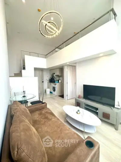 Modern loft apartment with stylish living room and open kitchen layout