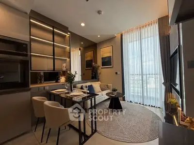 Modern living room with elegant decor and large window offering natural light