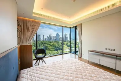 Luxurious bedroom with stunning city skyline view and modern decor