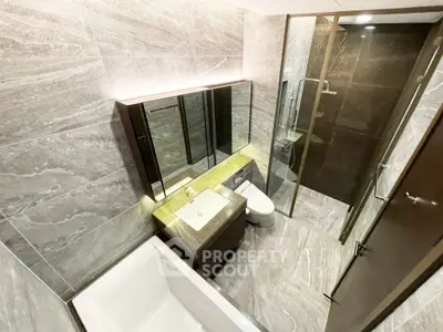 Luxurious modern bathroom with elegant stone tiles and sleek fixtures