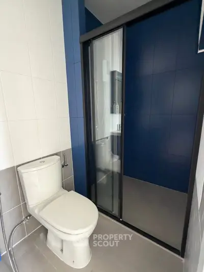 Modern bathroom with sleek shower and contemporary toilet design