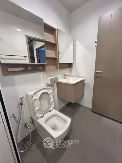 Modern bathroom with sleek fixtures and ample storage space