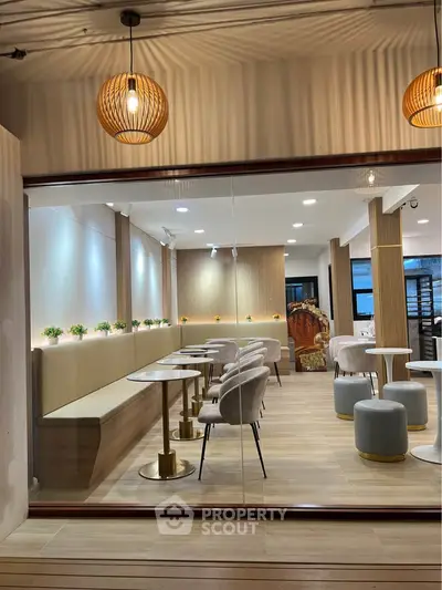 Modern interior with elegant seating and ambient lighting, perfect for a chic dining experience.