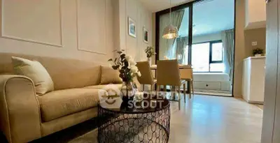 Modern living room with cozy sofa and dining area in open layout apartment.