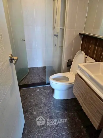 Modern bathroom with sleek design and glass shower enclosure