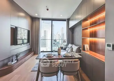 Modern living room with city view, elegant furniture, and built-in shelving.