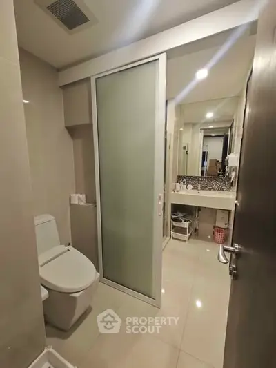 Modern bathroom with sleek design and large mirror