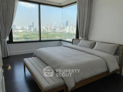 Luxurious bedroom with panoramic city view and elegant decor