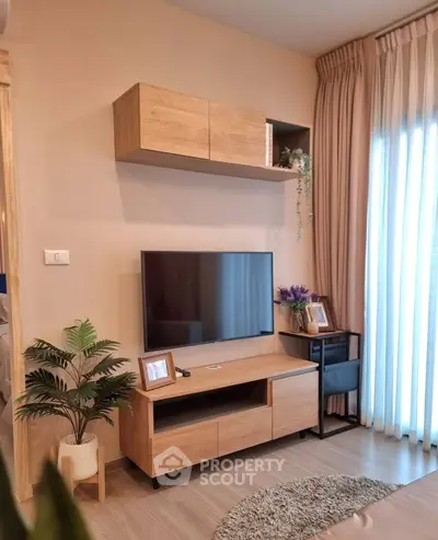 Modern living room with wooden TV stand and wall-mounted cabinet