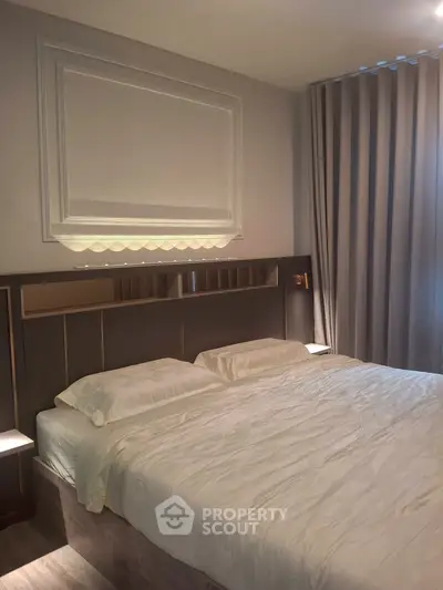 Luxurious bedroom with elegant decor and cozy ambiance, featuring a plush bed and stylish curtains.