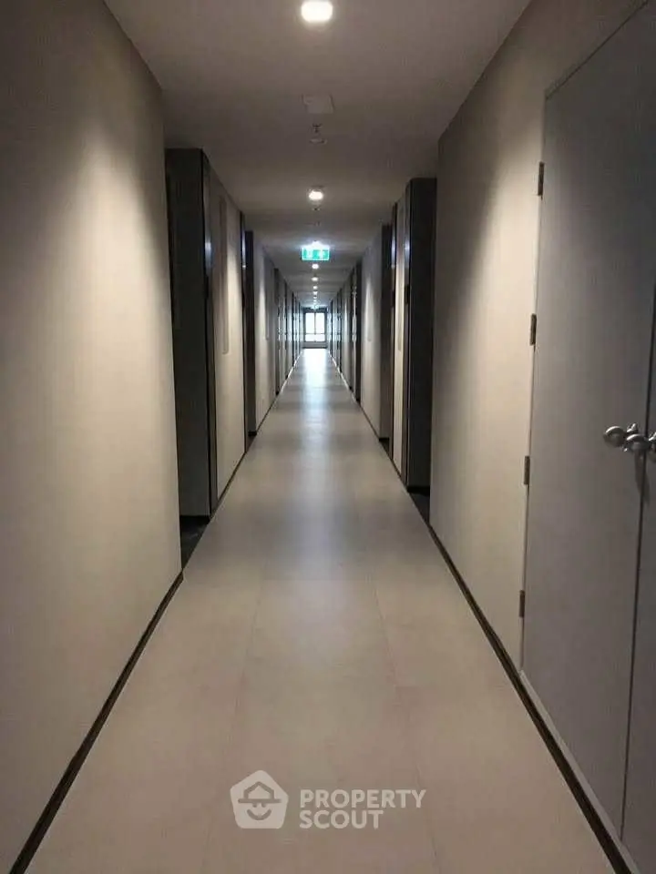 Modern apartment hallway with sleek design and bright lighting