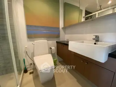 Modern bathroom with sleek fixtures and stylish cabinetry in a contemporary home.