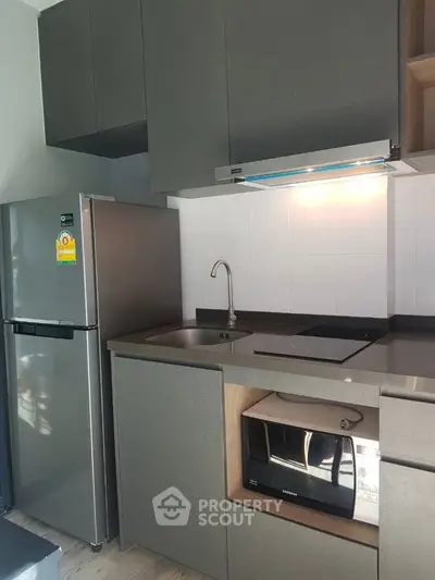 Modern kitchen with sleek cabinetry and stainless steel appliances