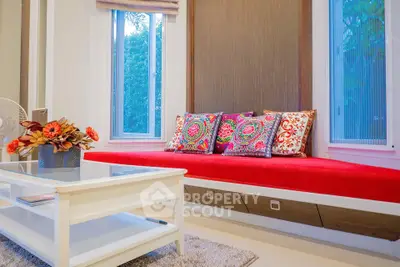 Charming living room with vibrant decor and cozy seating area.