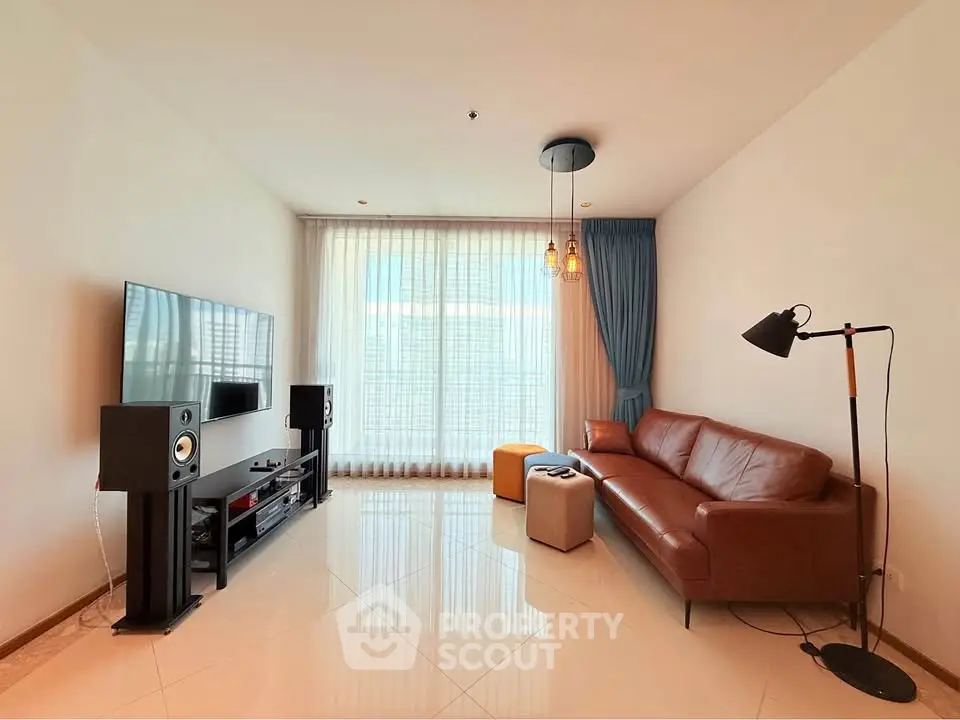 Modern living room with leather sofa and entertainment center