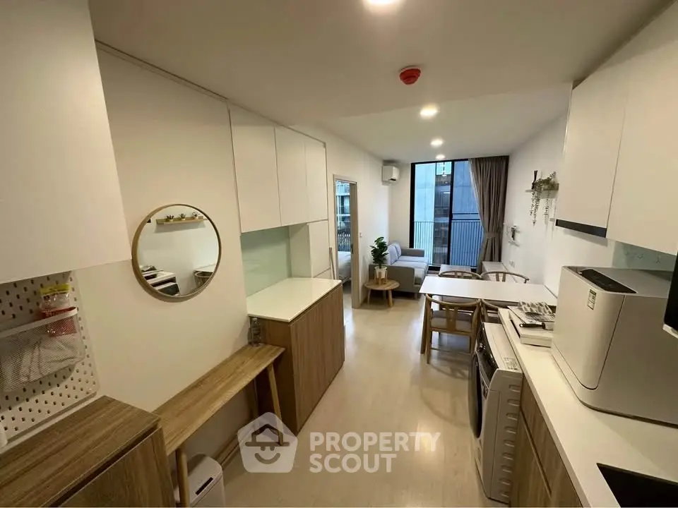 Modern open-plan living area with stylish decor and natural light