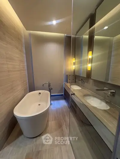 Luxurious modern bathroom with freestanding bathtub and elegant lighting